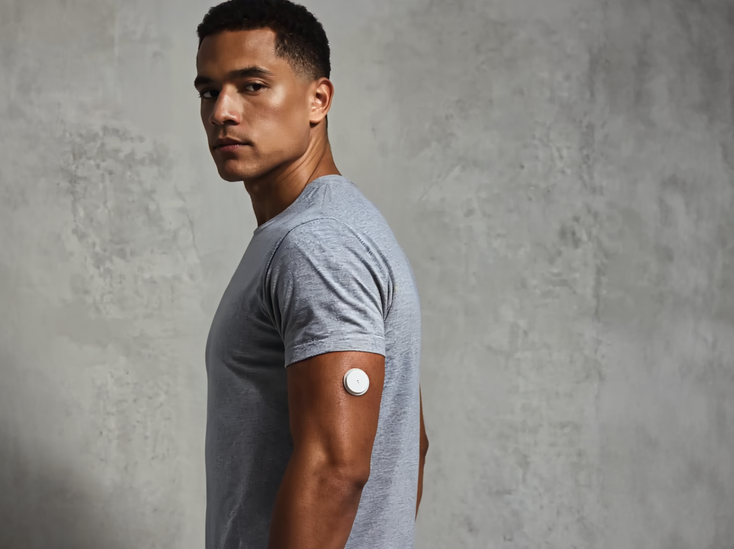 Person wearing continuous glucose monitor